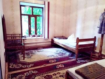 Фото номера Двухместный номер с 2 отдельными кроватями Гостевой дом Riverside Guest house Mashkhur г. Arslanbob 5